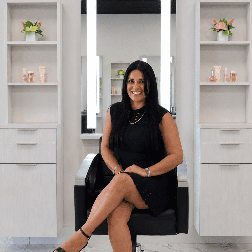 Portrait of Alba Buhmann, a professional stylist at The Beauty Lounge Salon + Blow Dry Bar, showcasing their expertise and style.