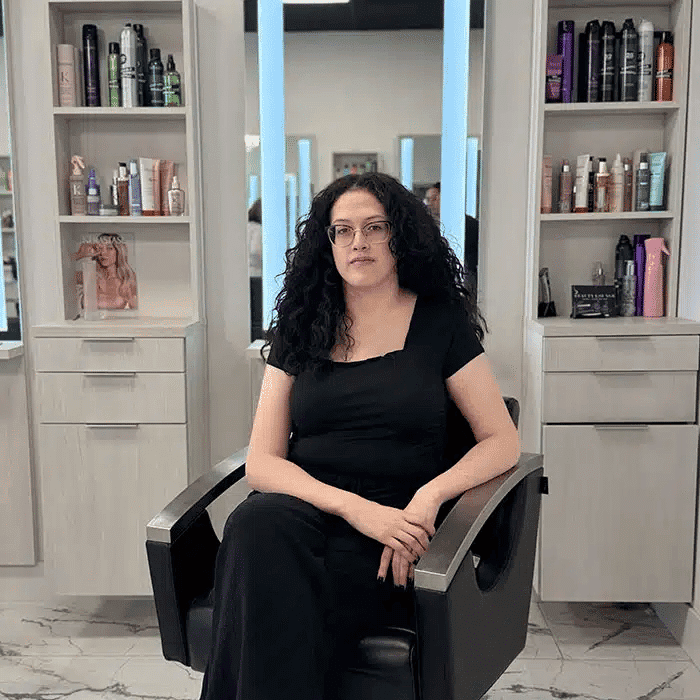 Portrait of Geiza Reyes, a professional stylist at The Beauty Lounge Salon + Blow Dry Bar, showcasing their expertise and style.