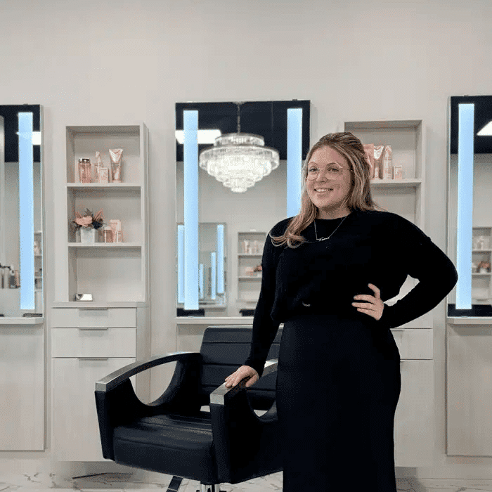 Portrait of Taylor Mae, a professional stylist at The Beauty Lounge Salon + Blow Dry Bar, showcasing their expertise and style.