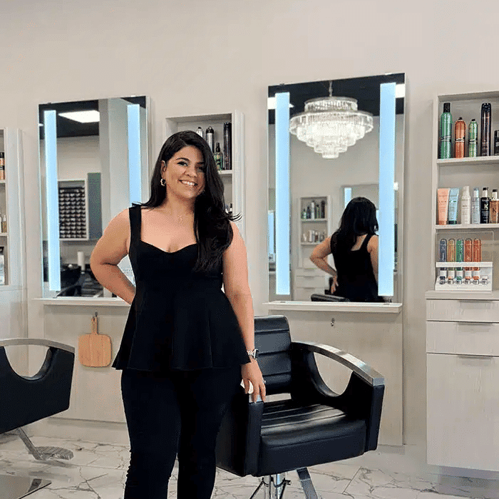 Portrait of Bianca Santos, a professional stylist at The Beauty Lounge Salon + Blow Dry Bar, showcasing their expertise and style.