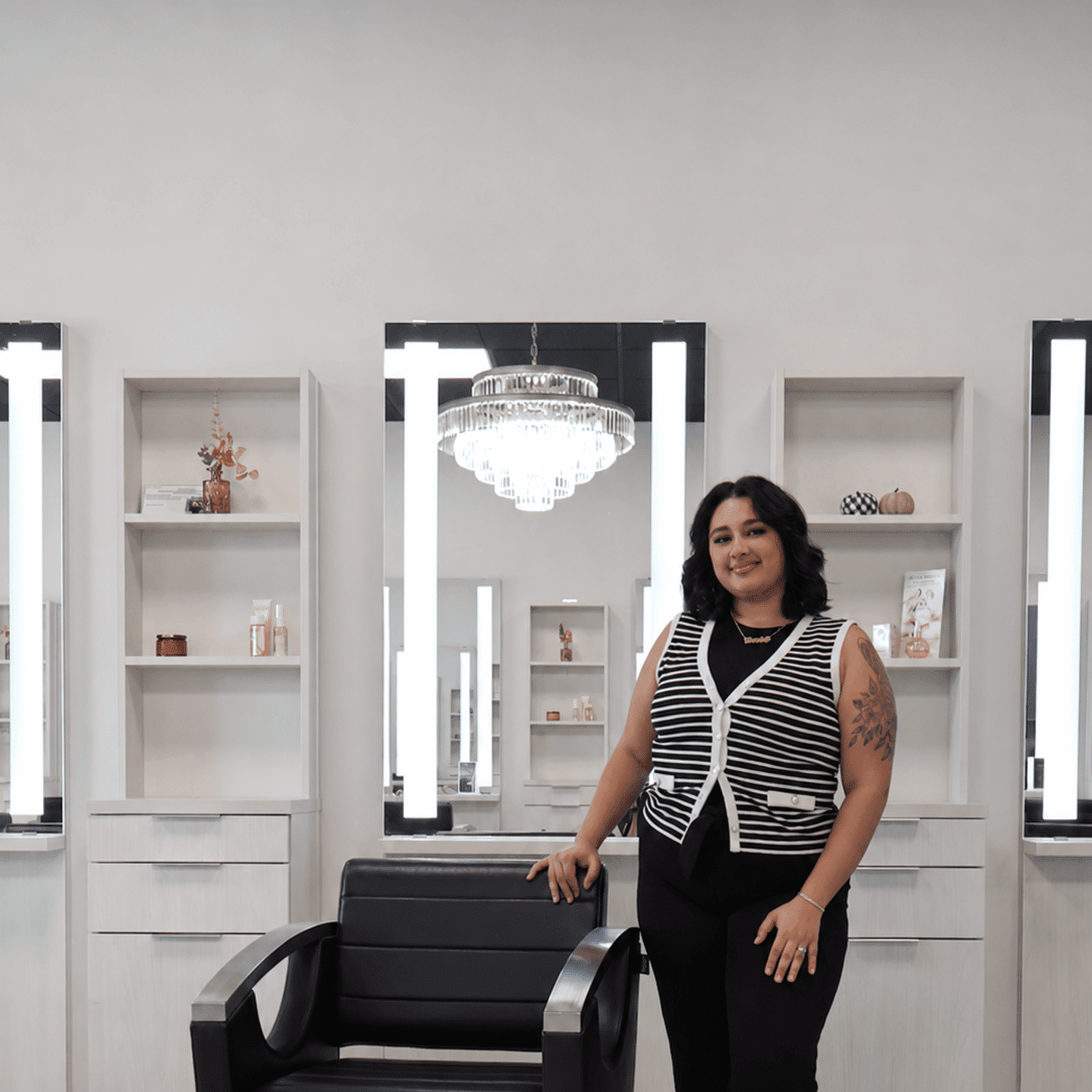 Portrait of Eliandra DeJesus, a professional stylist at The Beauty Lounge Salon + Blow Dry Bar, showcasing their expertise and style.