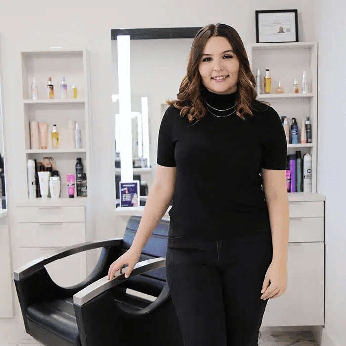 Portrait of Cloe Varga, a professional stylist at The Beauty Lounge Salon + Blow Dry Bar, showcasing their expertise and style.