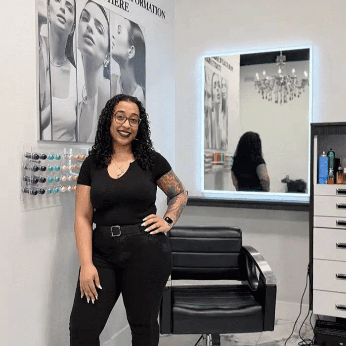 Portrait of Nessa Salinger, a professional stylist at The Beauty Lounge Salon + Blow Dry Bar, showcasing their expertise and style.